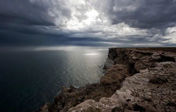 Picture sea, the sun, clouds, rocks