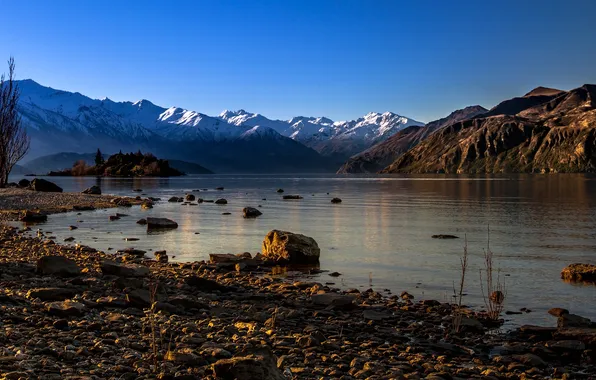 The sky, mountains, lake, stones