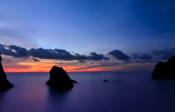The sky, clouds, sunset, orange, the ocean, rocks, shore, island
