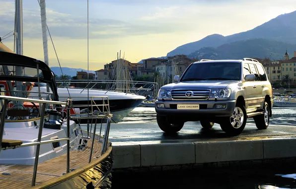 Picture the sky, mountain, home, yachts, pier, port, SUV, boats