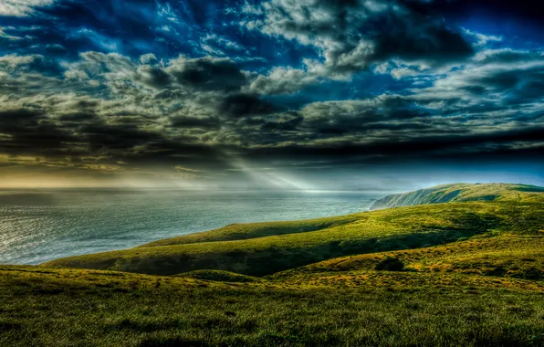 Picture sea, grass, clouds, rays, clouds, overcast, shore