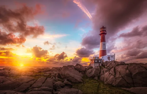 Sea, the sky, the sun, clouds, stones, dawn, coast, lighthouse