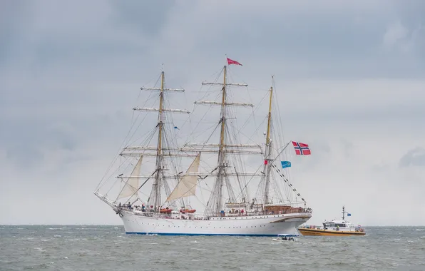 The ocean, ship, sailboat, flags