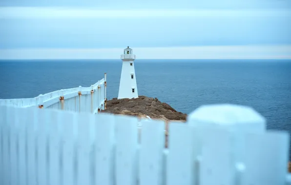 Seascape, fence, lighthouse