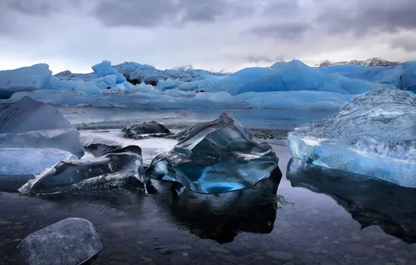 Ice, sea, the storm, water, stones, gray clouds