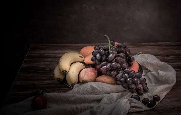The dark background, table, grapes, bananas, fabric, fruit, still life, cuts