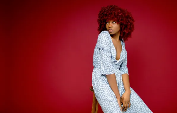 Look, sexy, sexy, red background, look, curly hair, sitting on a chair, red background