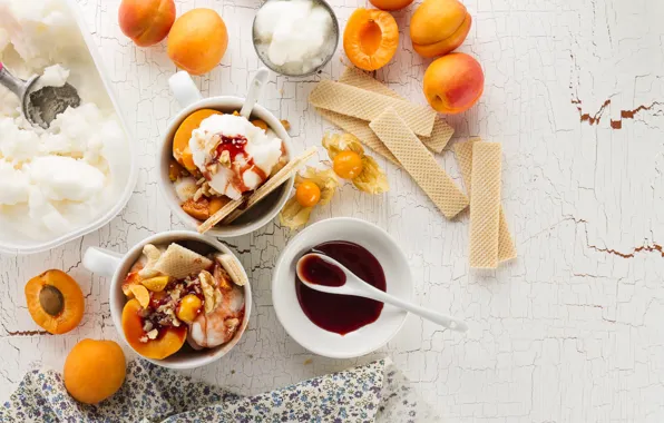 Fruit, waffles, syrup, apricots, ice cream, vanilla