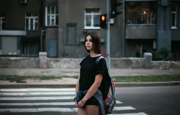 Girl, the city, traffic light