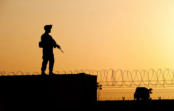 Picture the fence, silhouette, soldiers