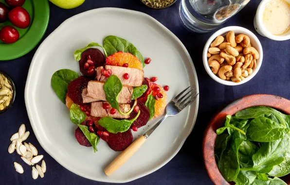 Plate, meat, plug, appetizer, beets, spinach, pomegranate seeds, cashew nuts