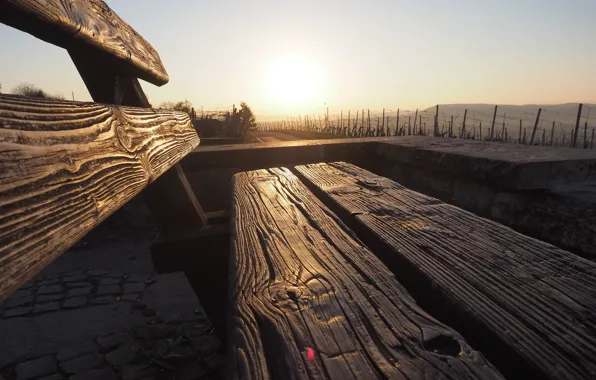 The sky, bench, the sun
