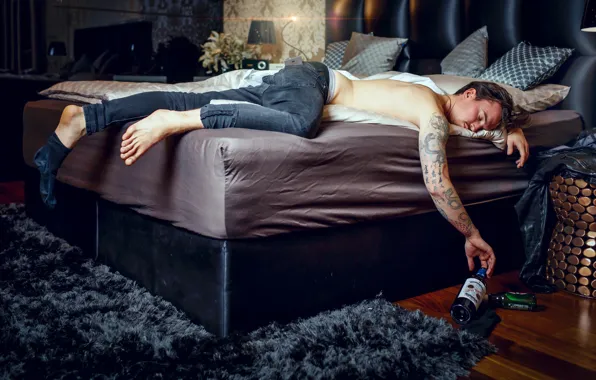 Picture bed, man, the situation, jeans, tattoo, bottle, drunk, sleep