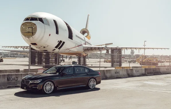 The plane, car, the airfield, BMW 7