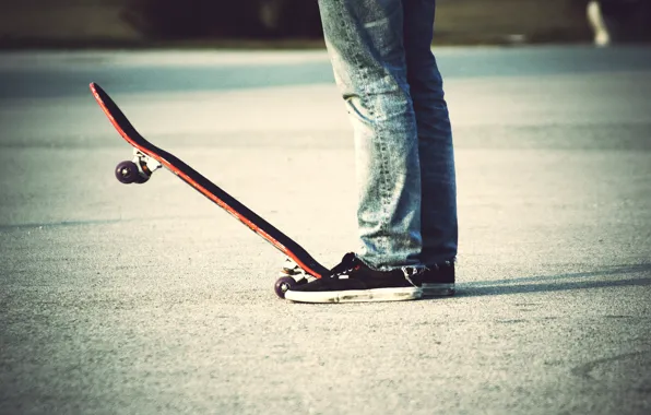 Sneakers, jeans, skateboard