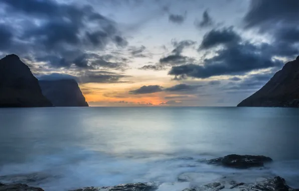 Picture the sky, clouds, sunset, mountains, stones, the ocean, shore, the evening