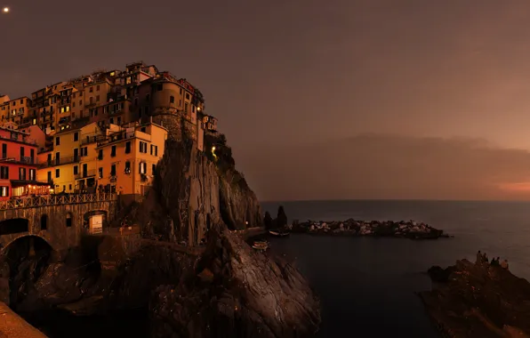 Sea, night, the city, people, rocks, shore, coast, building
