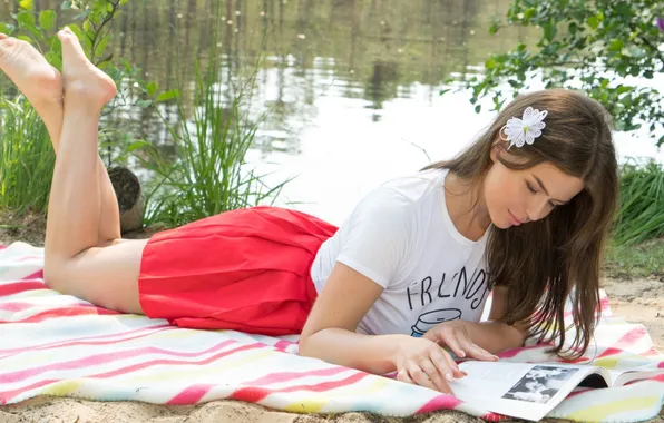 Nature, pond, skirt, barefoot, t-shirt, lies, book, brown hair