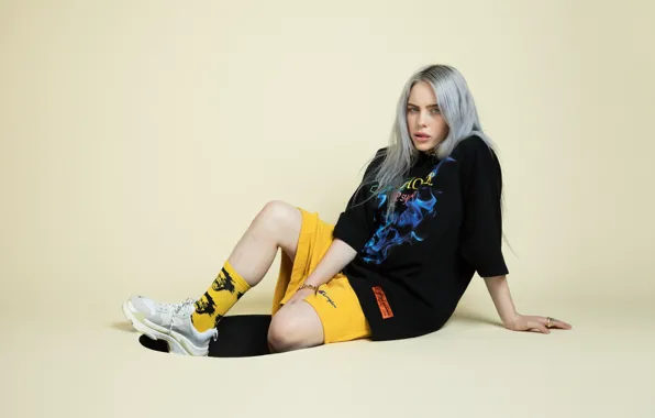 Hair, shorts, blonde, socks, singer, sitting, sneakers, singer