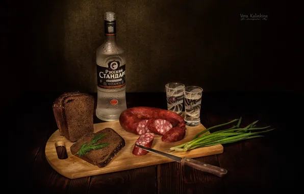 Picture bread, knife, vodka, sausage