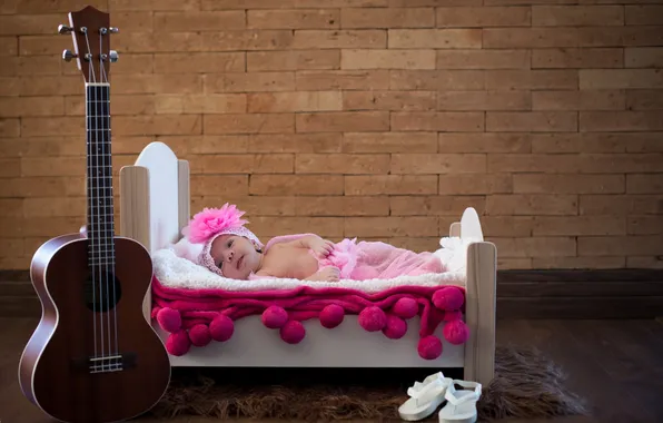 Picture guitar, bed, baby