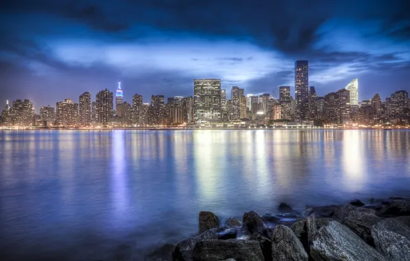 The city, river, stones, shore, the evening, megapolis, New York, East River