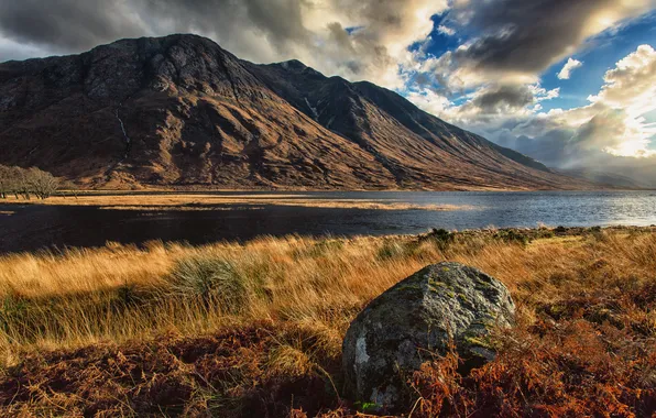 The sky, mountains, clouds, lake, stones