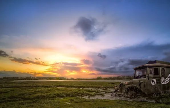 Field, machine, sunset