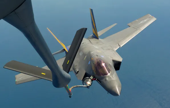 The sky, UNITED STATES AIR FORCE, fighter-bomber, F-35C, refuels from KC-135 tanker aircraft