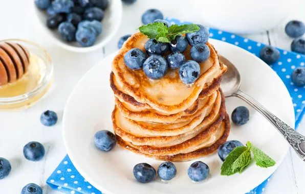 Honey, blueberries, pancakes