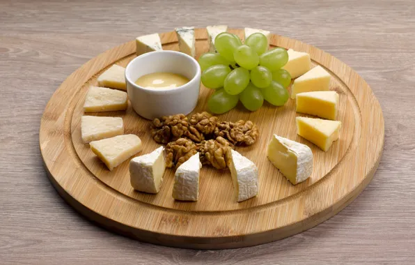 Cheese, grapes, nuts, cuts