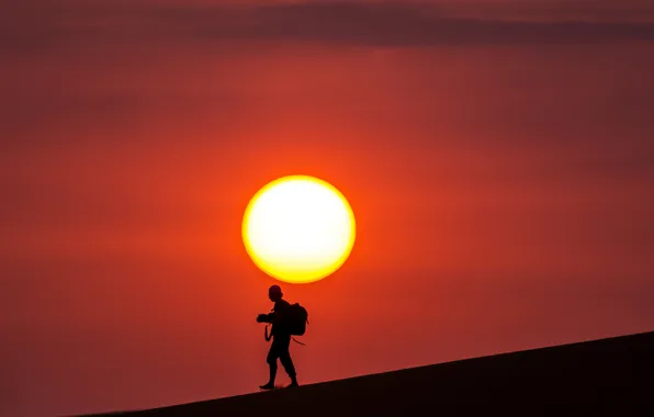 The sky, the sun, sunset, desert, people, silhouette