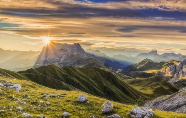 The sun, mountains, rocks, the slopes
