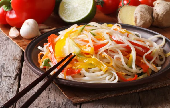 Sticks, lime, vegetables, garlic, ginger, noodles