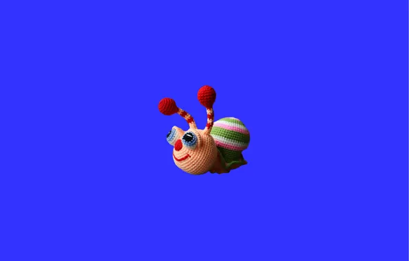 Toy, blue background, knitting, needlework, colorful snail