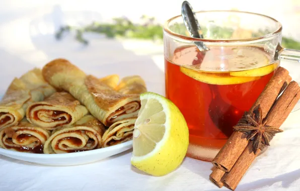 Lemon, tea, cinnamon, jam, pancakes, star anise