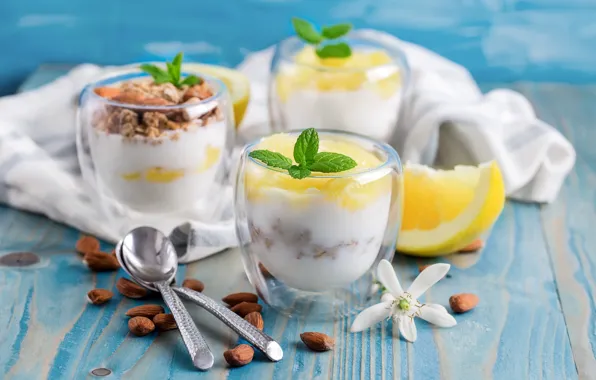 Glasses, nuts, grapefruit, almonds, spoon, yogurt