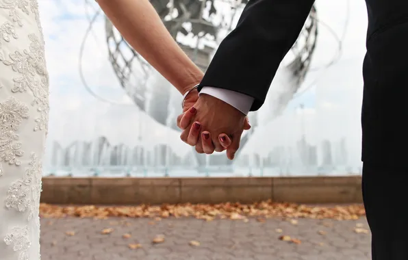 Hands, the bride, the groom