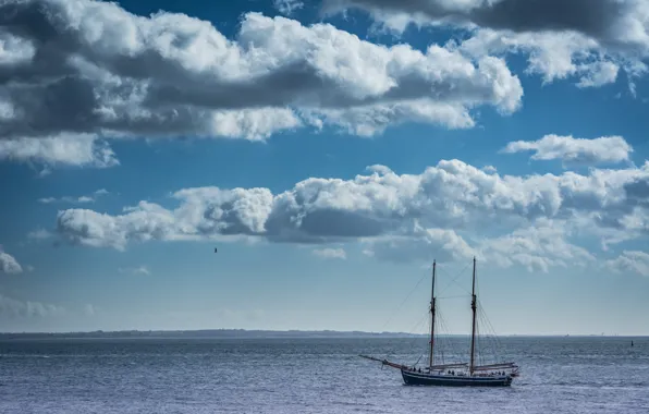 Sea, clouds, sailboat