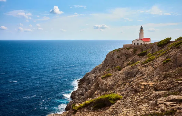 Sea, rocks, lighthouse