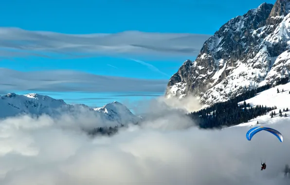 The sky, clouds, mountains, parachute