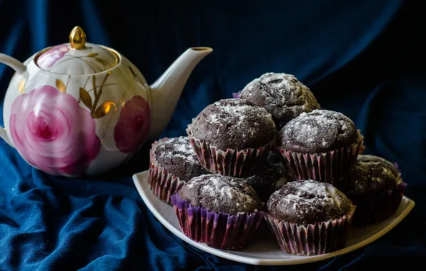 Tea, kettle, fabric, blue background, cakes, cupcakes, powdered sugar, chocolate