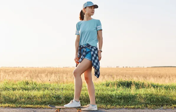 Girl, shorts, cap, skateboard, T-shirt, sneakers