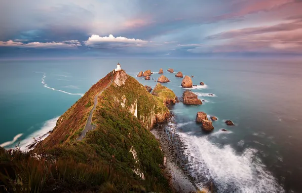 Sea, the sky, clouds, rocks, lighthouse