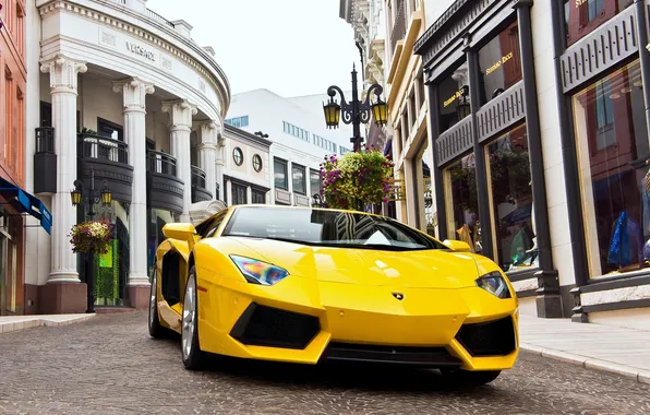 Picture the sky, yellow, street, building, lamborghini, yellow, the front, aventador