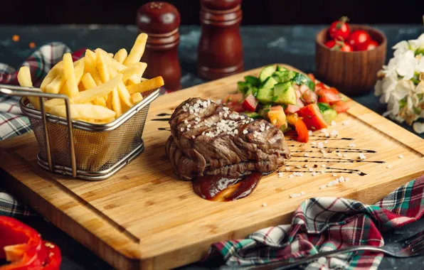 Meat, vegetables, sauce, salad, potatoes, salt, potatoes, fries