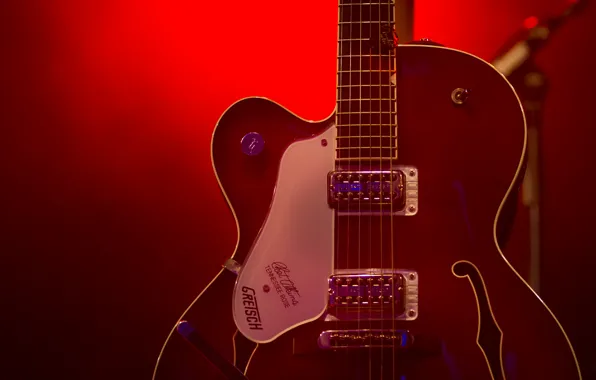 Guitar, strings, red light, stage