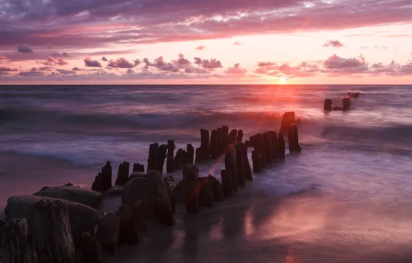 Sunset, stones, the ocean, pink, posts, Shore, pierce