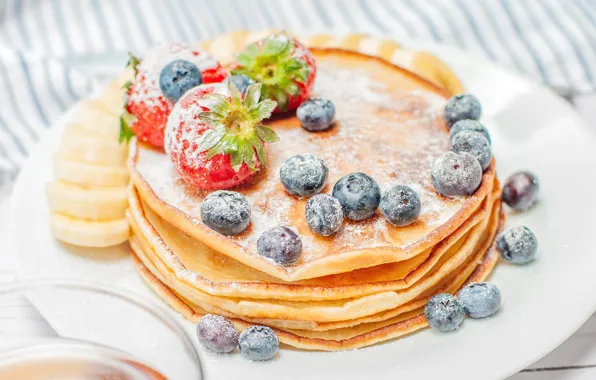 Berries, blueberries, strawberry, plate, bananas, stack, light background, pancakes