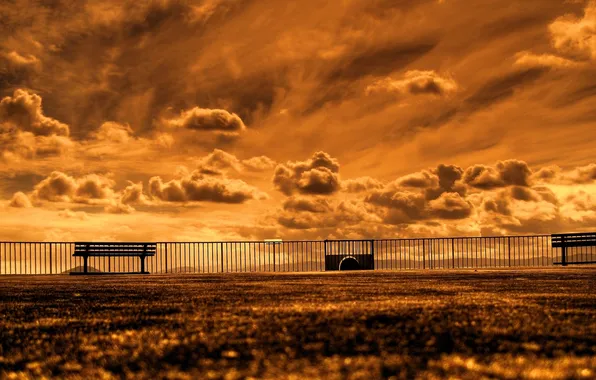 The SKY, CLOUDS, BENCHES, RAILINGS, PLAYGROUND